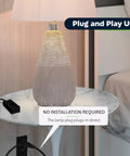 Table Top Plug In Dimmer For Lamps With Quiet Slide Control Dims 10 To 100 Percent plugged into a lamp on a bedside table