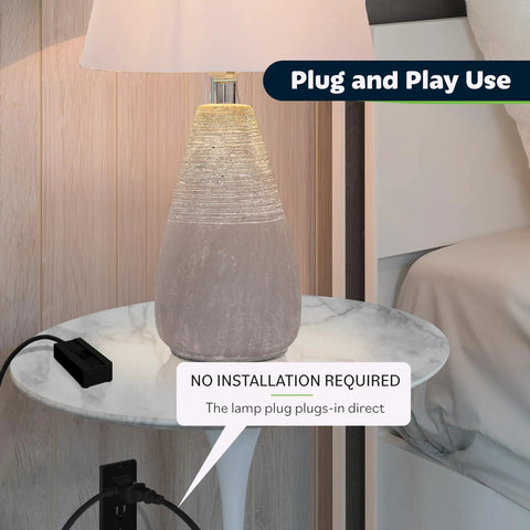 Table Top Plug In Dimmer For Lamps With Quiet Slide Control Dims 10 To 100 Percent plugged into a lamp on a bedside table