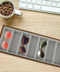 Top Shelf Walnut Wooden Sunglasses Tray With Silky Gray Velvet Liner, Roomy Seven Slot Eyewear Display Rack on a wooden desk.