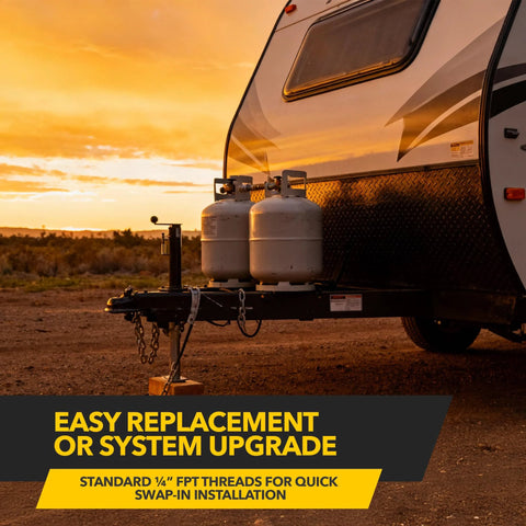 RV propane tanks on A-frame trailer hitch, dual aluminum cylinders at sunset