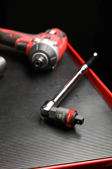 3/8-Inch Drive Ratcheting Breaker Bar Adapter Converts Breaker Bar Or Sliding T-Handle Into a 24-Tooth Ratchet on tool bench