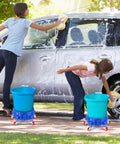 Get This 5 Gallon Bucket Dolly Cart With Swivel Casters For Easy Mobility, used while washing a car with two blue dollies.