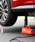 15 Ton All Metal Hydraulic Electric Car Jack With 12V DC Power Portable Auto Lift in use lifting car with red finish