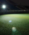 JUDYSSY Solar Flood Lights 60W Solar Outdoor Patio Lighting illuminating a field at night, showcasing bright LED light control.