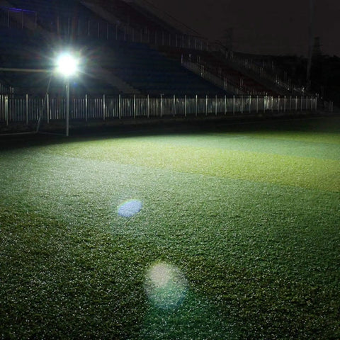 JUDYSSY Solar Flood Lights 60W Solar Outdoor Patio Lighting illuminating a field at night, showcasing bright LED light control.