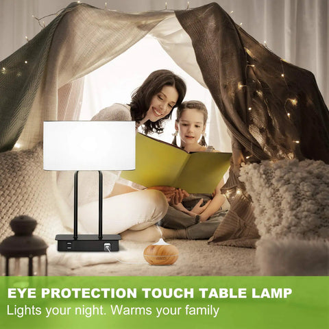 Family reading under a tent with Bedside Touch Control Table Lamp With Dual USB Ports And AC Outlet, white fabric shade