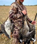 Hunter using Waterfowl Tote with 12 drops slip ring and paracord, heavy duty metal loop goose and duck hanger in field