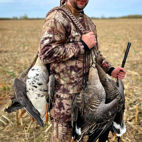Hunter using Waterfowl Tote with 12 drops slip ring and paracord, heavy duty metal loop goose and duck hanger in field