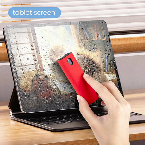 Hand using 6 Pack Screen Cleaner Kit 2 In 1 Touchscreen Mist Cleaner, Spray And Wipe With Microfiber Cloth on tablet screen