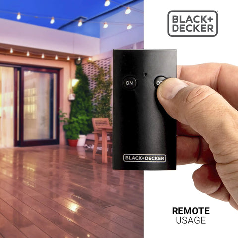 Dual Outlet Outdoor Timer Switch With Wireless Remote For Yard Lights And Garden Decor No Sweat Scheduling Slick Plug In Convenience Top Shelf All Weather Construction in use with remote.