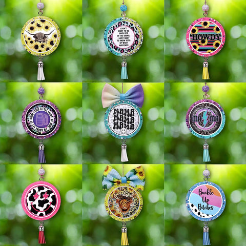 A variety of car freshies from the Car Freshie Starter Kit With 1 Pound Scented Aroma Beads, featuring diverse designs and tassels.
