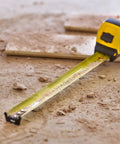 Fatmax Tape Measure With Blade Armor And Dual Scale 8m Length, Mylar coated blade extended on construction site