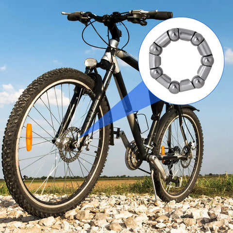 Mountain bike on rocky path with zoomed-in view of a ball bearing from 20 Pcs Bike Bearing Set For BMX And Road Rides