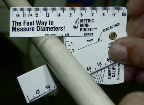 Dead Nuts Reliable Mini Metric Pipe Diameter Caliper And Ruler Set Heavy Duty Vinyl Gauge with swing arm measuring pipe diameter.