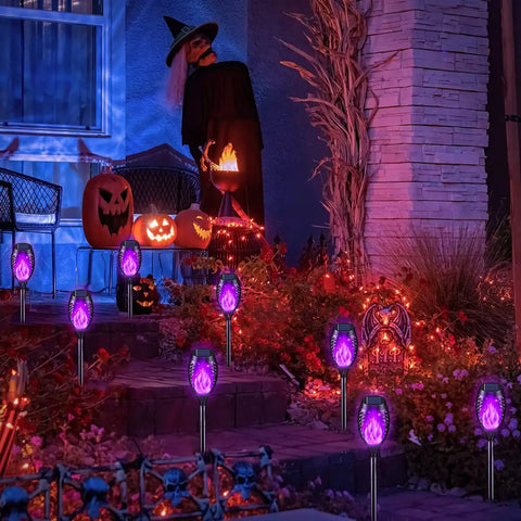 Solar Tiki Torch Lights Eight Piece Purple Outdoor Garden Decor With Realistic Flickering Flame for Halloween parties.