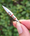 Close-up of a single 100 Grain Archery Field Point For Target Practice Screw In Arrow Tip for Recurve and Compound Bows, stainless steel with O rings.