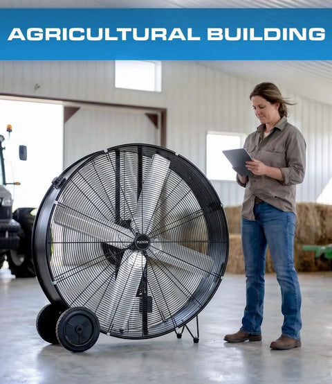 Heavy Hitter 42 Inch Industrial Drum Fan Moves Serious High Velocity Air For Garage Or Workshop Cools 24500 CFM With Smooth Rolling Casters Two Pack No Fuss Design in an agricultural setting.