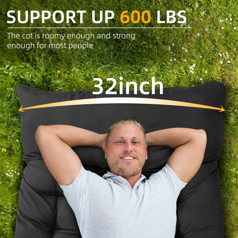 Person lying on Extra Wide 32 Inch Camping Cot With Thick Mattress Holds Up To 600 Lbs, demonstrating size and comfort outdoors.