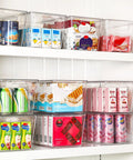 Hella Nifty Clear Stackable Storage Bins With Secure Snap Lids And Comfortable Side Handles And Large 6 Pack Real Deal Option For Kitchen Pantry Closet Fridge Under Sink Bathroom Organization filled with assorted snacks on shelving.