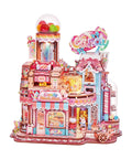 Candy Workshop 3D Wooden Puzzle Kit for Adults With Mechanical Transmission, featuring colorful miniature house scene.