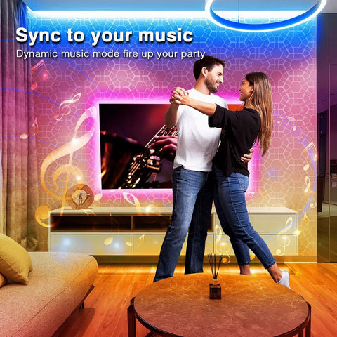 Couple dancing with 100 Ft Bluetooth LED Strip Lights With Music Sync And Color Changing 5050 RGB Tape Lighting in living room