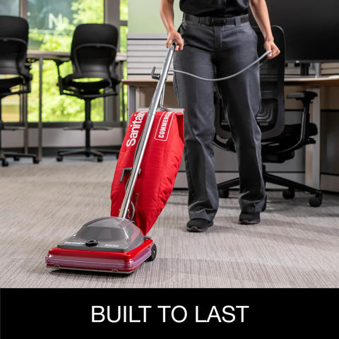 Hardcore Commercial Upright Bagged Vacuum Cleaner With Vibra Groomer Brush Roll, Fifty Foot Power Cord, Six Decked Out Height Settings, Beefy Long Life Motor, And Zero Hassle Shake Out Bags in use on office carpet.