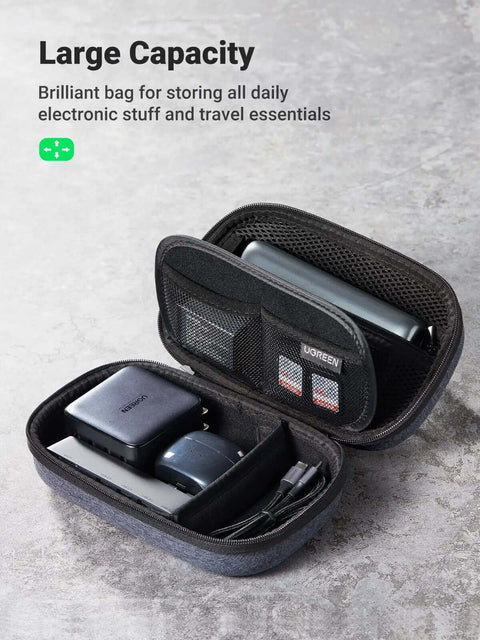 Rugged Hardshell Tech Organizer Travel Case Packs All Your Fresh Gadgets Square With Nifty Double Layer Pouch For Cables Chargers And Memory Cards In Sleek Space Grey with electronic devices inside.
