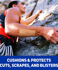 Rock climber using Extra Large Fabric Adhesive Bandages 3x4 Inches Nonstick Breathable Flexible Wound Care on forearm.