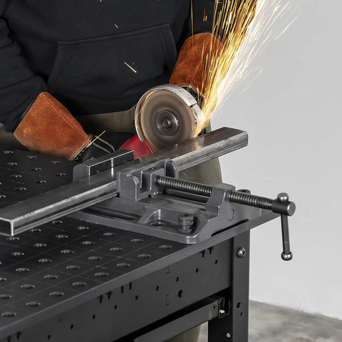 Heavy Duty Drill Press Vise Six Point Three Inch Opening Rock Solid With 3000 Lb Clamping Force Portable on metal table.
