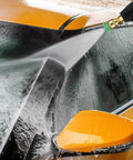 High Pressure Washer Gun For Cars And Power Washers, 4350 PSI Beast Mode Ready spraying water on an orange car for cleaning