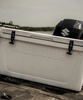 Bombproof 125 Quart Insulated Cooler Tough As Nails Rotomolded Hard Ice Chest on a boat with an outboard motor.