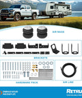 RETRUE rear air bag suspension kit for Toyota Tacoma; front view shows two airbags, brackets, hardware, and air line.