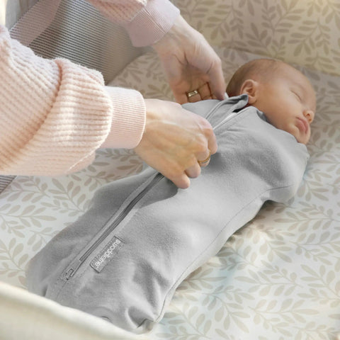 Newborn Compression Swaddle Pod with Two Way Zipper for Easy Diaper Changes calms startle reflex and improves sleep in crib