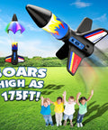 Electric Flying Model Rocket Kit For Kids With Launcher And Parachute Recovery System, USB Charging Cable Included, Fully Charged In About 35 Minutes, Reusable Backyard Fun For High Fliers. Foam rocket with parachute open on grassy field
