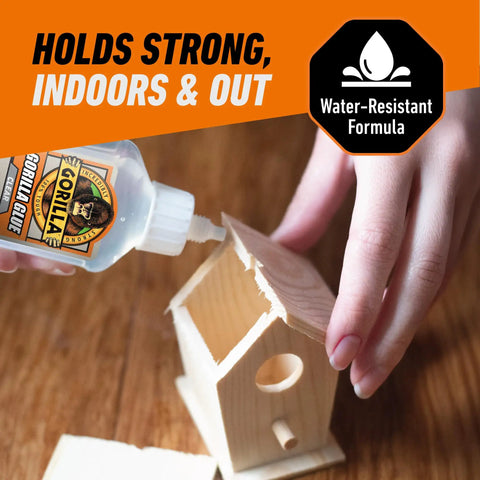 Person using Crystal Clear All Purpose Glue For Wood Metal Stone Ceramic Foam Glass And More Water Resistant Non Foaming Liquid Adhesive For Quick Bonds On DIY Projects 1.75 Ounce Bottle to assemble a wooden birdhouse.