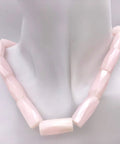 Premium Pink Calcite Faceted Tube Beads 20x10mm Genuine Natural Stone For Jewelry Making necklace displayed on a mannequin