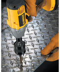 Impact Driver Drill Chuck With One Quarter Inch Quick Connect being used on metal surface, showing one hand tightening feature.