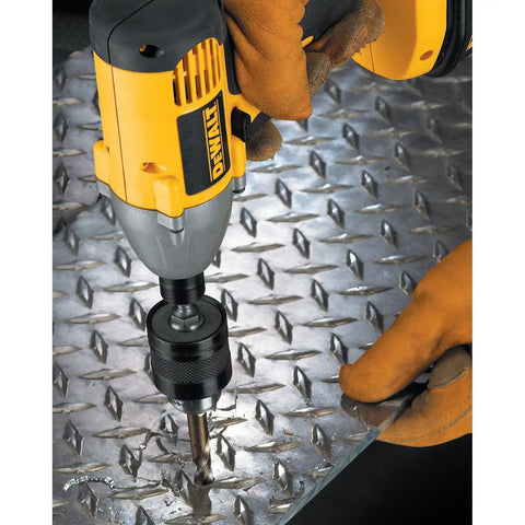 Impact Driver Drill Chuck With One Quarter Inch Quick Connect being used on metal surface, showing one hand tightening feature.