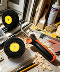Drywall Corner Roller Set With Heavy Duty Frame and Dual Roller Heads Glides Over Inside and Outside Angles Spreads Joint Compound and Paint Like a Champ Seamless Finish Tool for Serious DIY Hustle No Fuss Job on cluttered workbench.