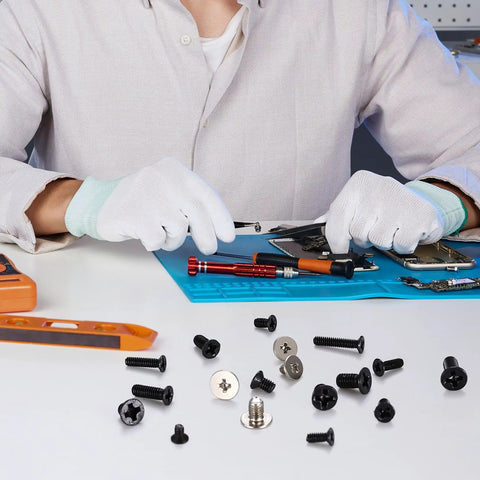 Person using 600 Pcs Tiny Screw Assortment Kit For Glasses Electronics Watches And Laptops M2 M2.5 M3 micro screws on a workbench