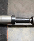 Astro Pneumatic exhaust pipe stretcher kit: metallic rod with black connector and clamp, side view