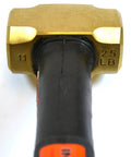 Close-up of the Brass Head Sledge Hammer With Indestructible 12-Inch Handle, showing the 2.5 lb spark-resistant head and rubber grip.