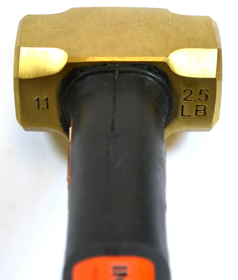 Close-up of the Brass Head Sledge Hammer With Indestructible 12-Inch Handle, showing the 2.5 lb spark-resistant head and rubber grip.