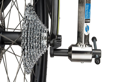 Derailleur Hanger Alignment Gauge DAG Two Point Two Pro Grade Bike Tool installed on bicycle with thru-axle setup.