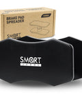 Brake Caliper Compression Tool For Twin And Quad Piston Calipers in durable black alloy steel with packaging in background