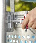 Universal Construction Control Cabinet Key With Plug In Magnetic Support being used on industrial cabinet lock.