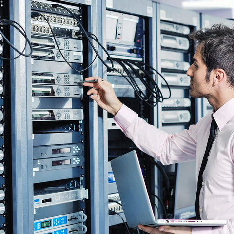 Technician working on 19 inch server cabinets with Four Pack 4U Blank Rack Panels For 19 Inch Server Cabinets Heavy Duty Metal Spacers.