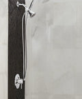 Chrome Pivoting Shower Arm Diverter With Hand Shower Cradle in bathroom, showing water flow switch for showerhead and handheld use.