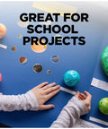 Child creating school project with Double Sided Craft Tape 1/2 Inch Wide By 300 Inch Long Permanent Adhesive For Scrapbooks on blue board