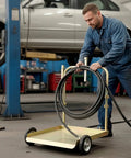Heavy Duty Workhorse Three To One Air Operated Oil Pump Kit Featuring Digital Meter Gun 13 Foot Hose Mobile Drum Trolley And Pressure Regulator For SAE 240 Transfer In Standard Fifty Five Gallon Drums being used in a workshop.